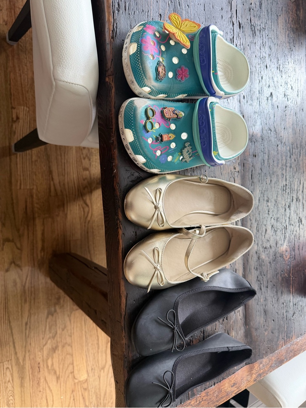 4 pair of shoes. 2 gold Janie and Jack one crocs one hm ballet flat